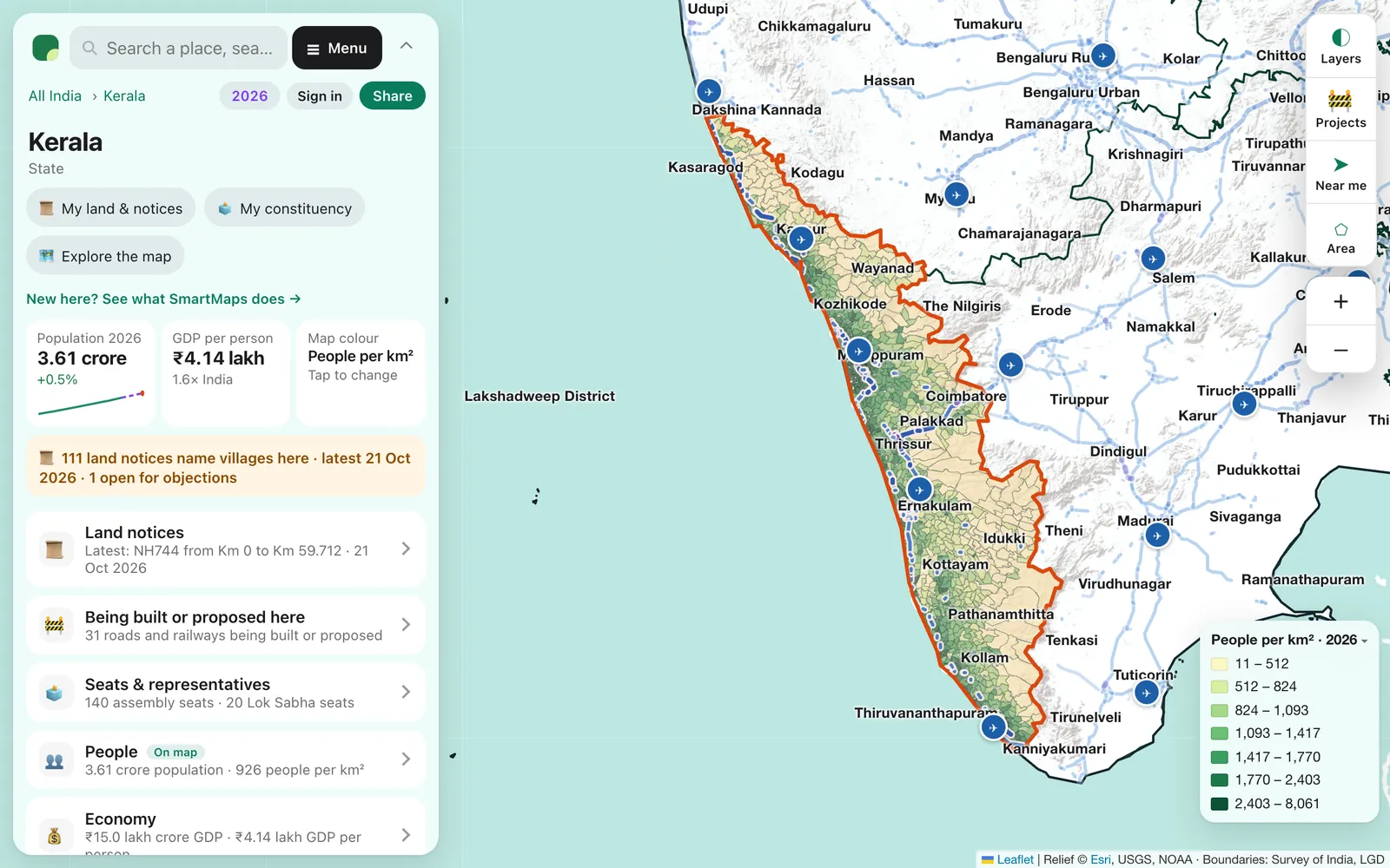 SmartMaps in Kerala: local bodies coloured by people per km², with a card listing land notices, projects being built and seats